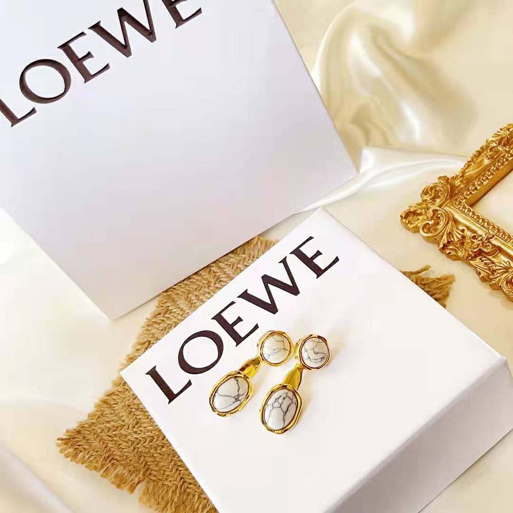 Close-up detail of metal hardware on Loewe Women Double Tree Earrings