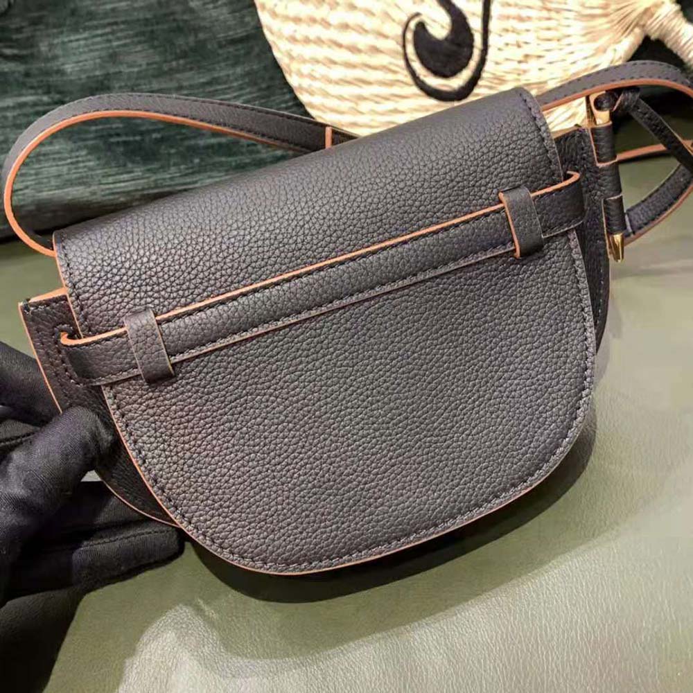 Side angle showing compact silhouette of Loewe Women Mini Gate Dual Bag
