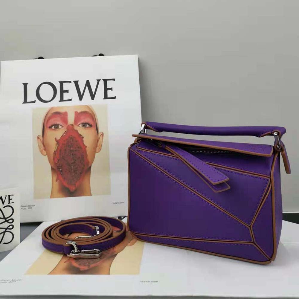 Side profile highlighting gold hardware on Loewe Women Mini Puzzle Bag