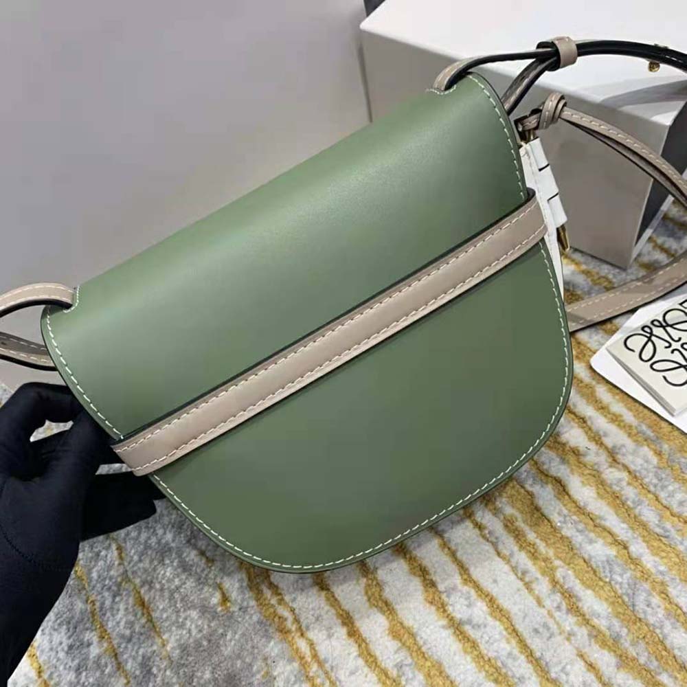 Side angle showing slim profile of Loewe Women Small Gate Bag in green leather