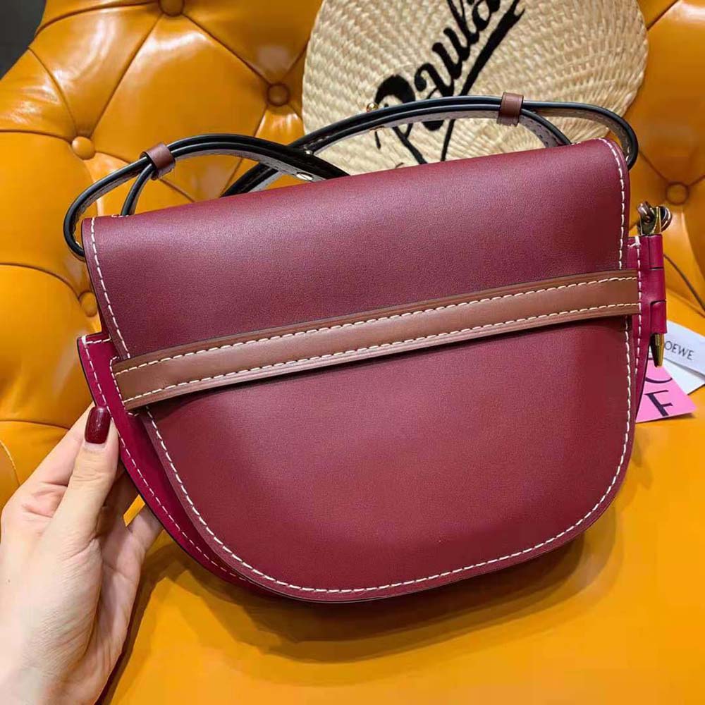 Side profile showing compact shape of Loewe Women Small Gate Bag