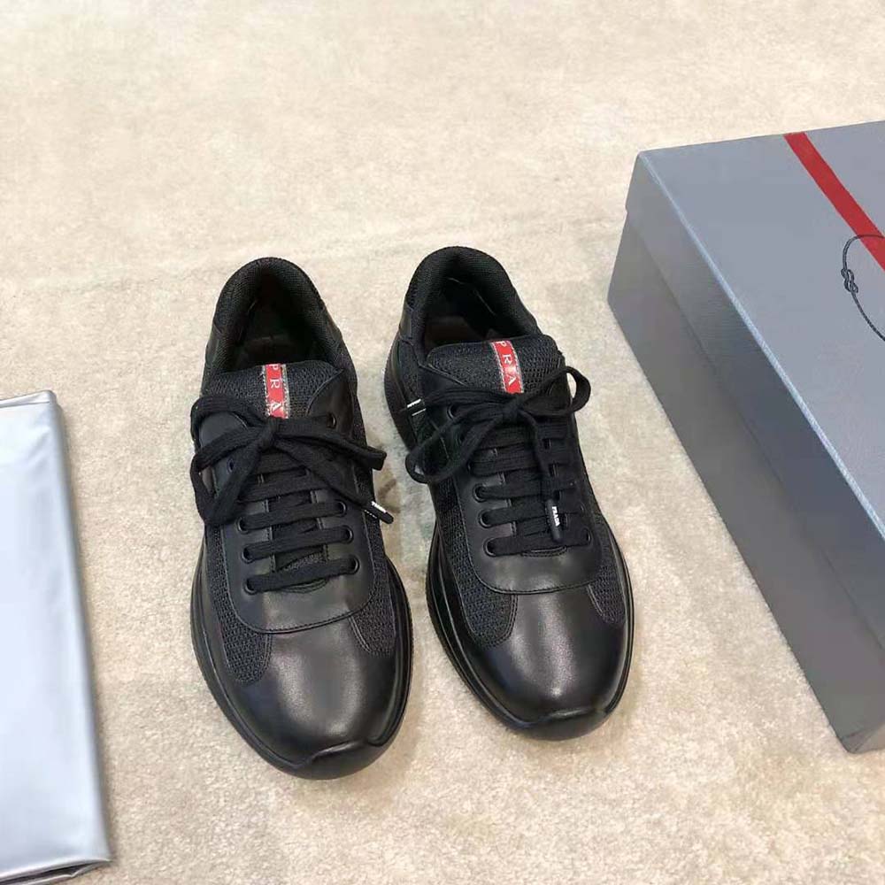 Close-up of black leather and signature Prada logo detail on sneaker