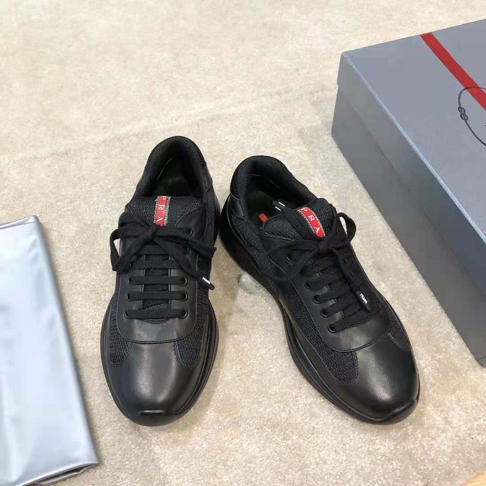 Top-down angle showcasing laces and technical fabric of Prada sneakers