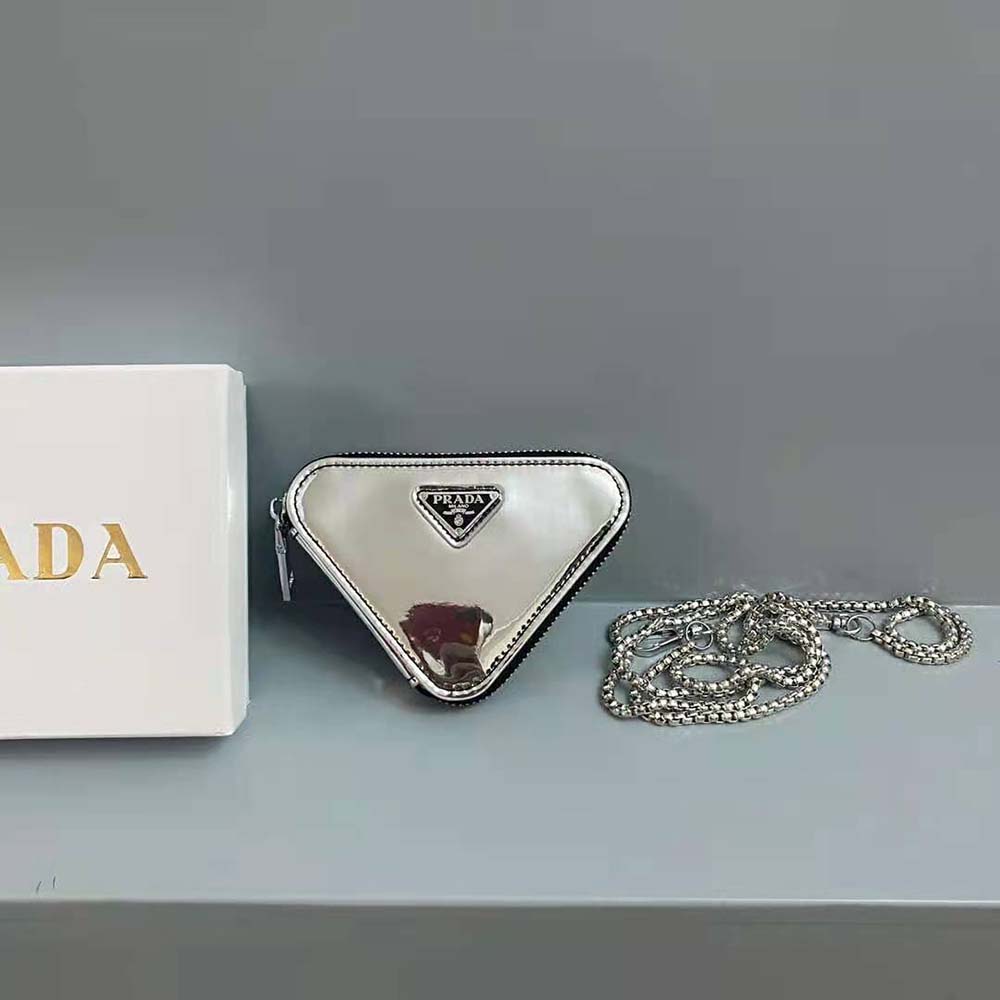 Close-up of silver-tone hardware and Prada logo on mini-pouch