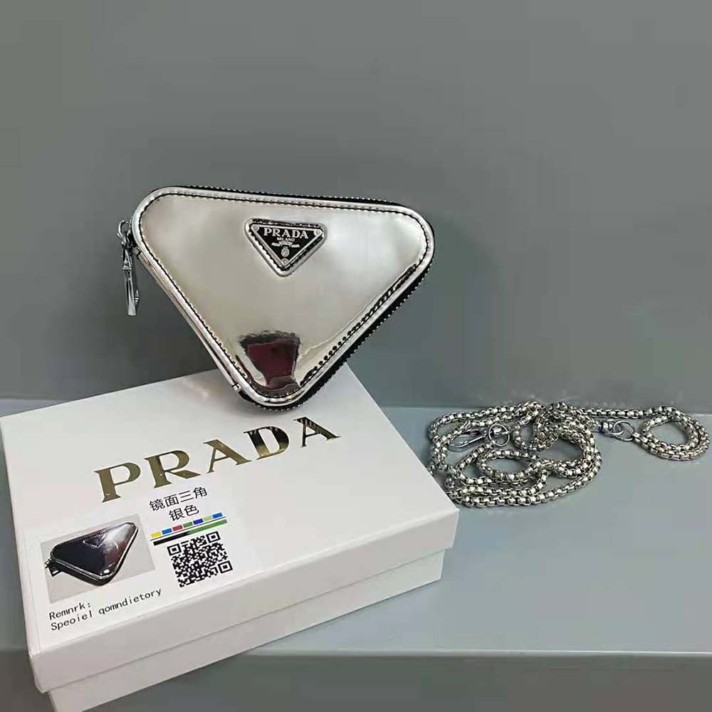 Angled shot highlighting brushed leather texture on Prada mini-pouch