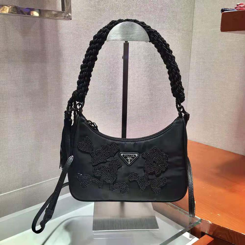 Close-up of silver-tone hardware on Prada Women Nylon Bag with Embroidery-Black