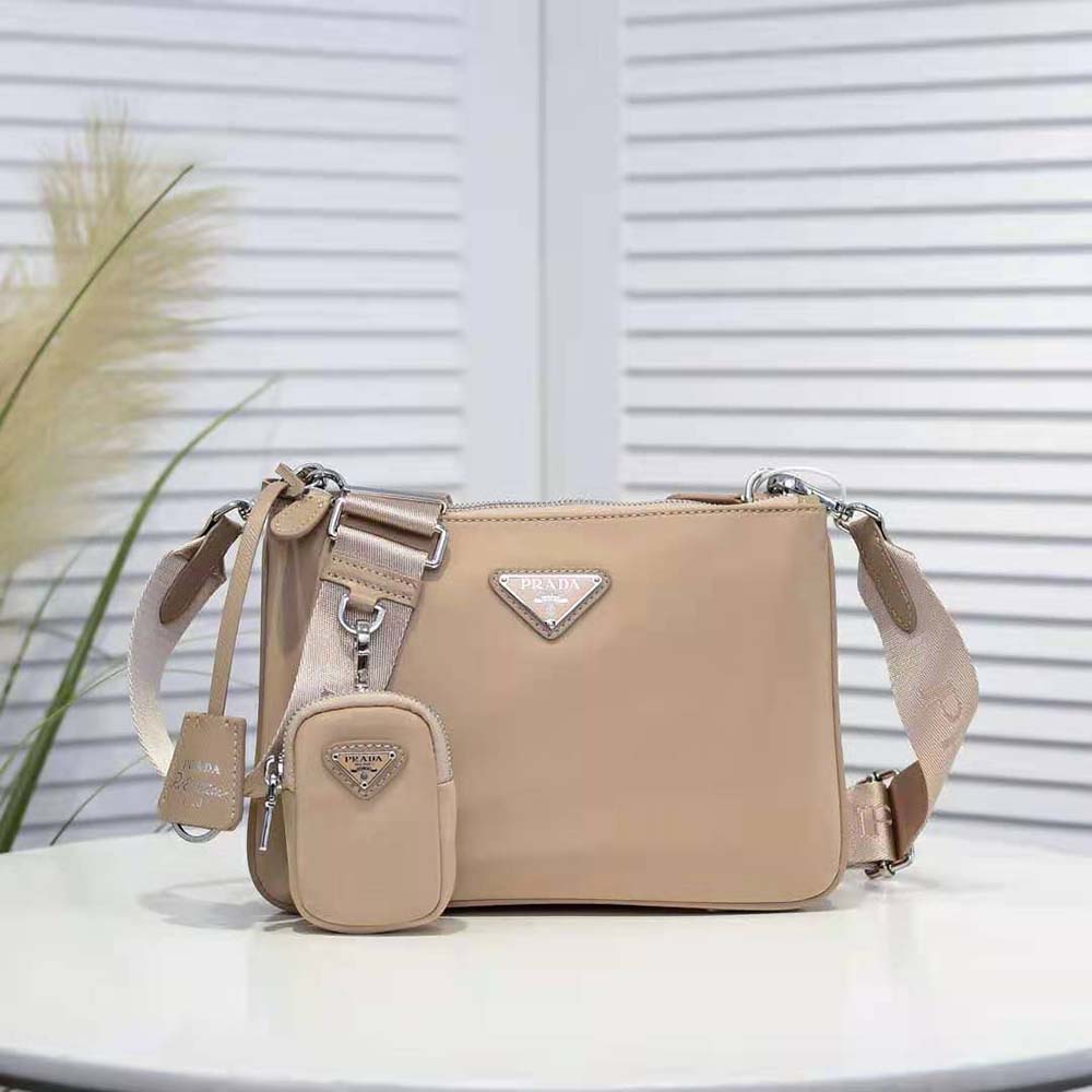 Close-up of silver closure and signature logo on Prada Women Nylon Re-Edition 2000 Shoulder Bag-Pink