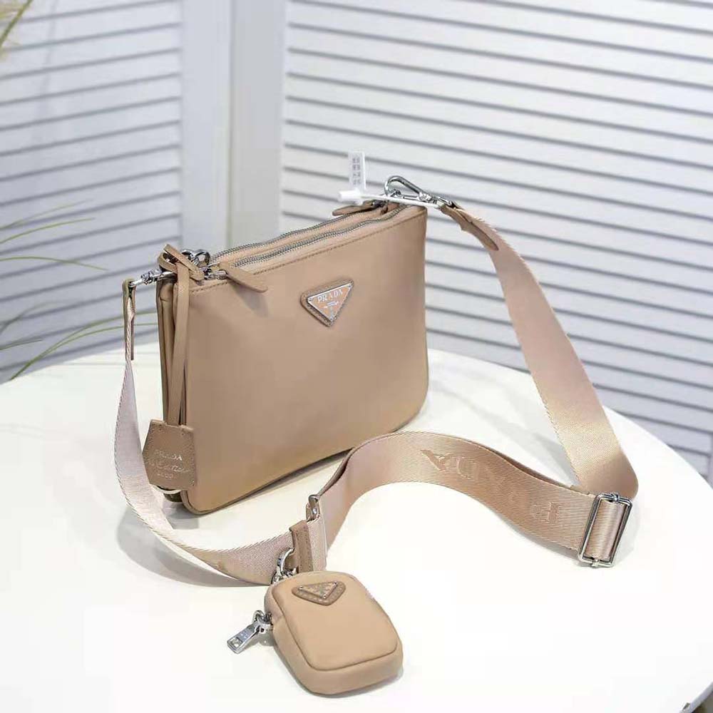 Side angle showing adjustable strap on Prada Women Nylon Re-Edition 2000 Shoulder Bag-Pink