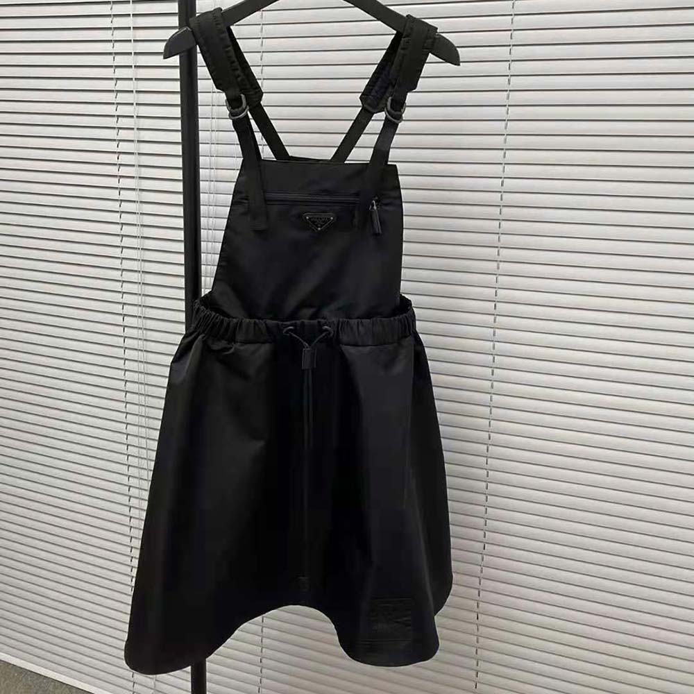 Close-up of Prada signature logo on black Gabardine Pinafore Dress
