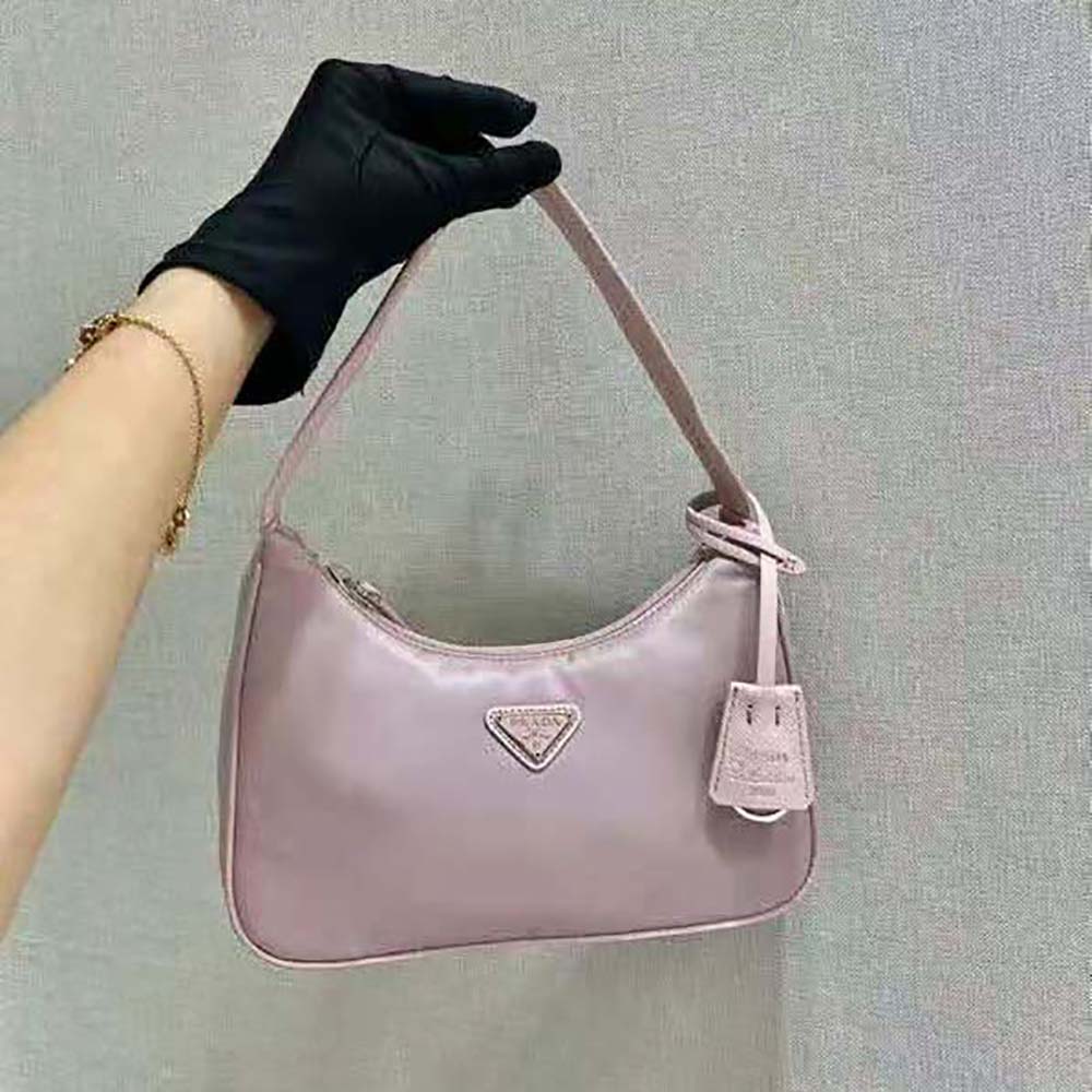 Close-up of pink nylon fabric and silver zipper on Prada mini-bag