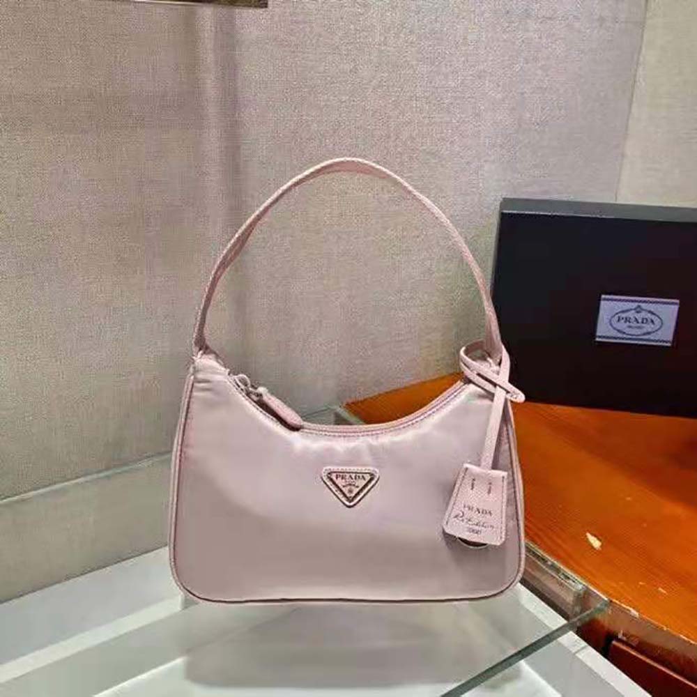 Side angle showing adjustable shoulder strap on Prada Re-Nylon mini-bag