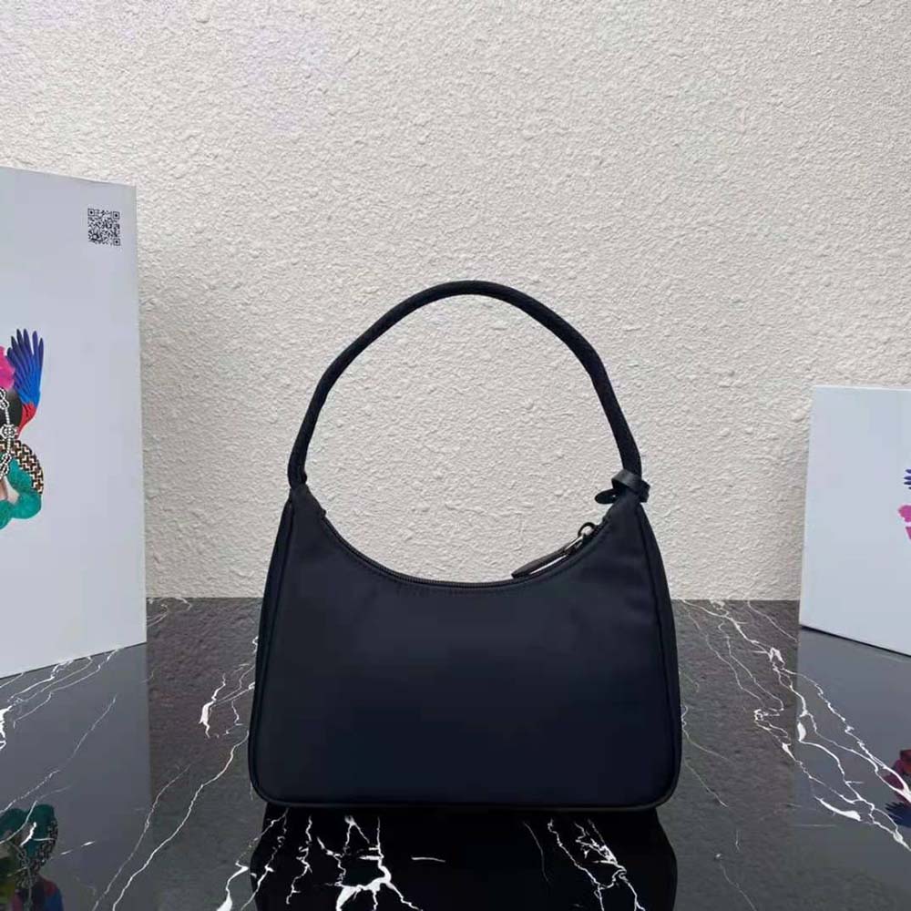 Side angle showing adjustable strap of Prada Re-Nylon Re-Edition Mini-Bag