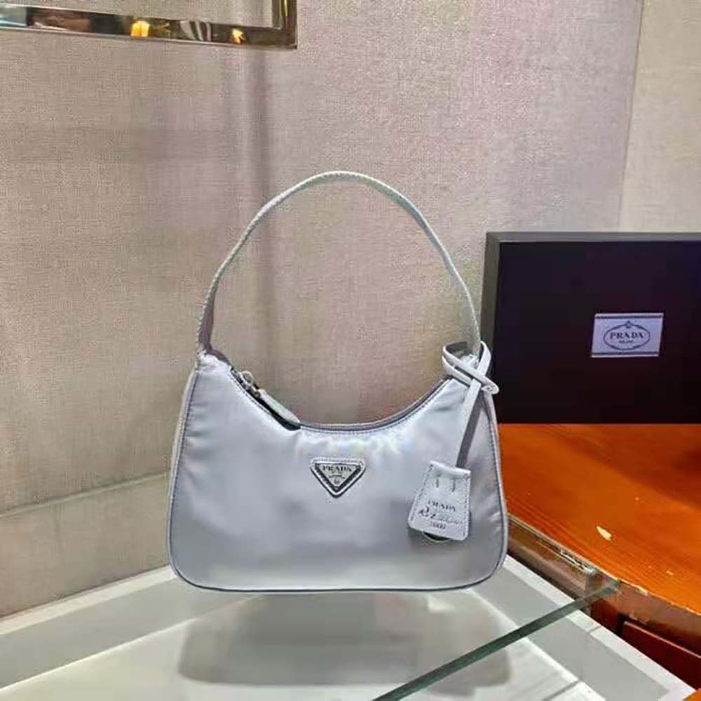 Side profile showing adjustable strap on Prada Women Re-Nylon Mini-Bag Silver
