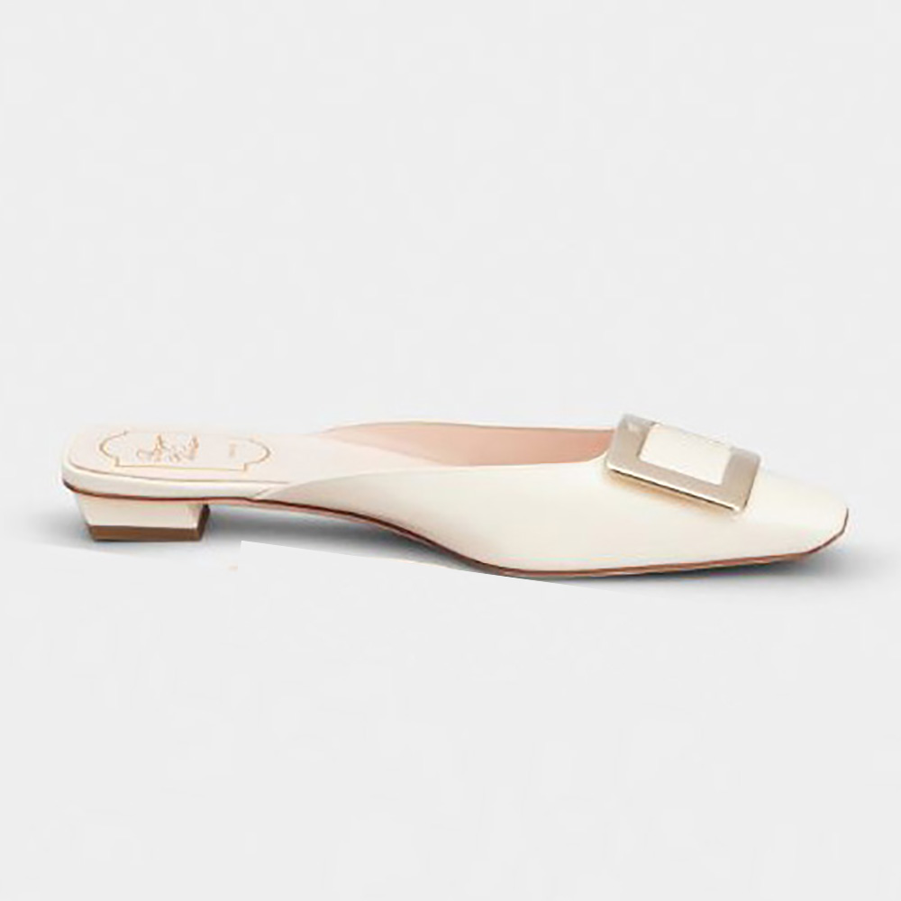 Side angle of Roger Vivier Belle Vivier Metal Buckle Mules in white patent leather