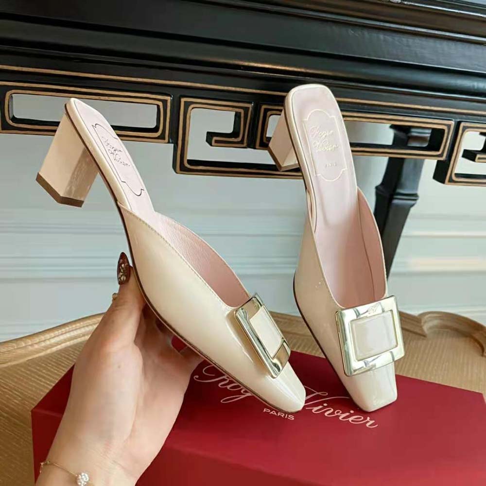 Overhead angle showing heel and glossy patent leather of Belle Vivier Metal Buckle Mules