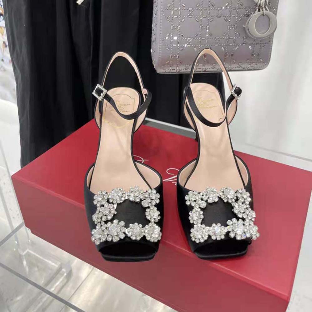 Close-up of flower strass buckle detail on Roger Vivier black satin sandals