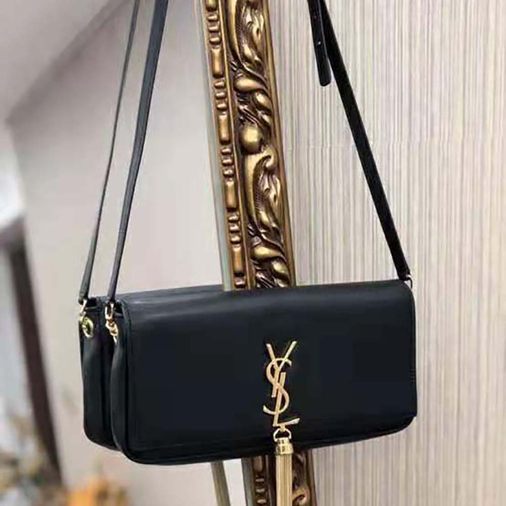 Close-up of gold YSL logo and tassel detail on Kate 99 handbag