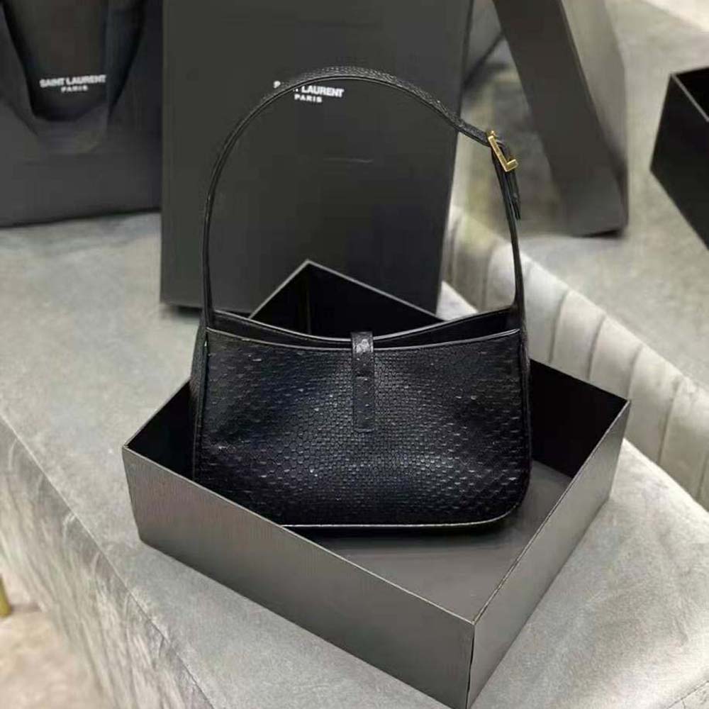 Side angle showing hobo silhouette and shoulder strap of Saint Laurent YSL bag