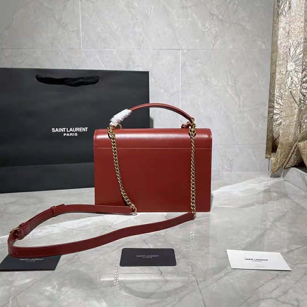 Side angle showing smooth leather and flap closure on Saint Laurent YSL Satchel
