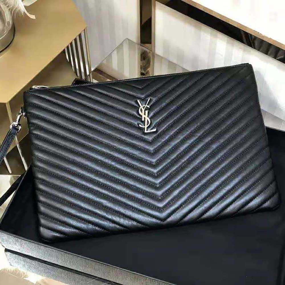 Close-up of black Matelasse leather texture and silver YSL logo hardware