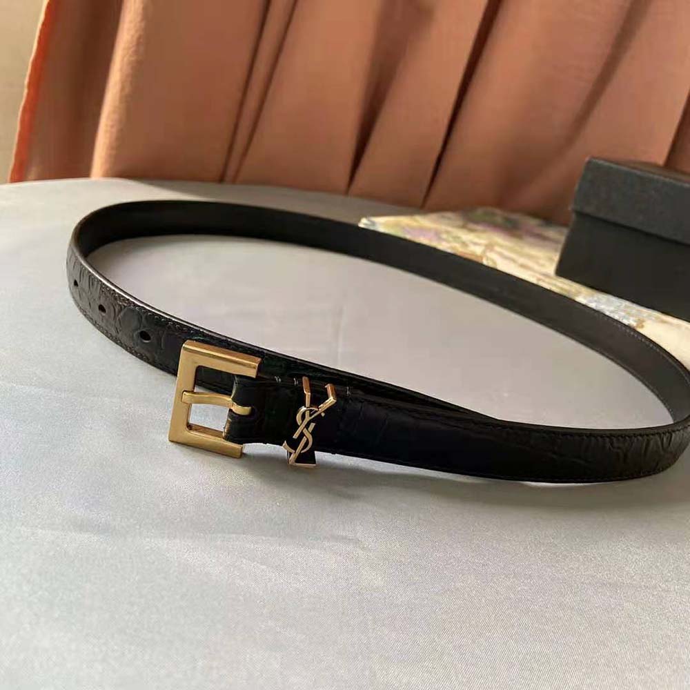 Close-up of square buckle with YSL monogram on narrow belt