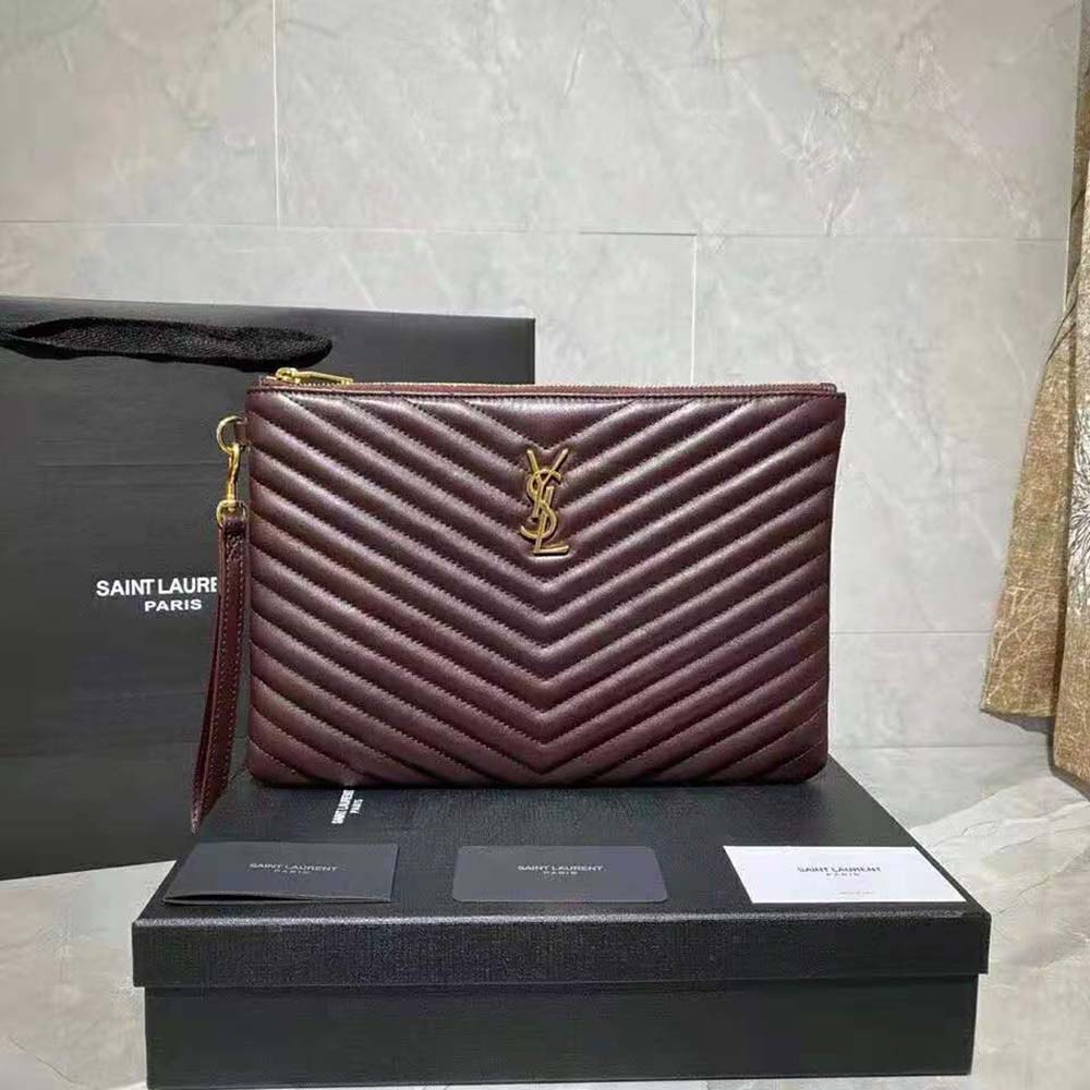 Close-up of YSL monogram and quilted matelasse leather detail on pouch