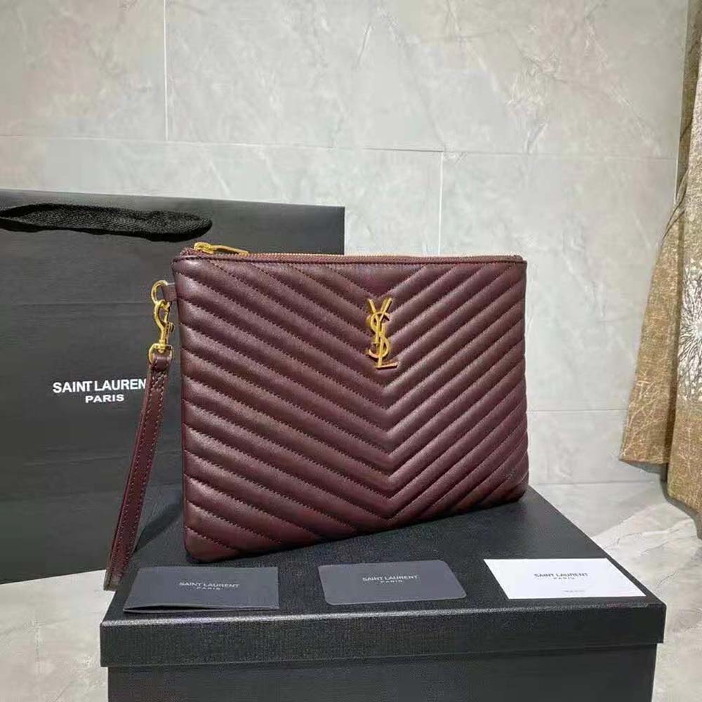 Side angle showing slim silhouette of Saint Laurent YSL tablet pouch