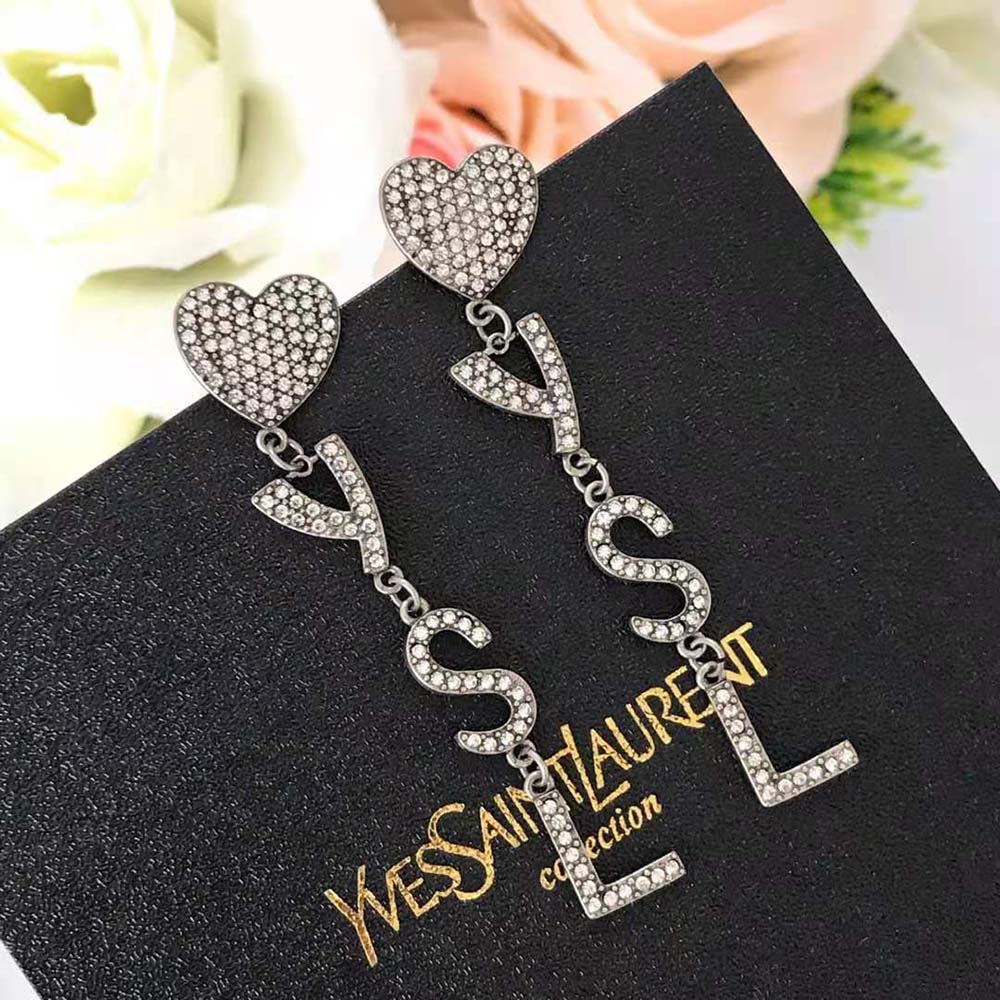 Close-up detail of crystal and YSL heart motif on Saint Laurent YSL Earrings