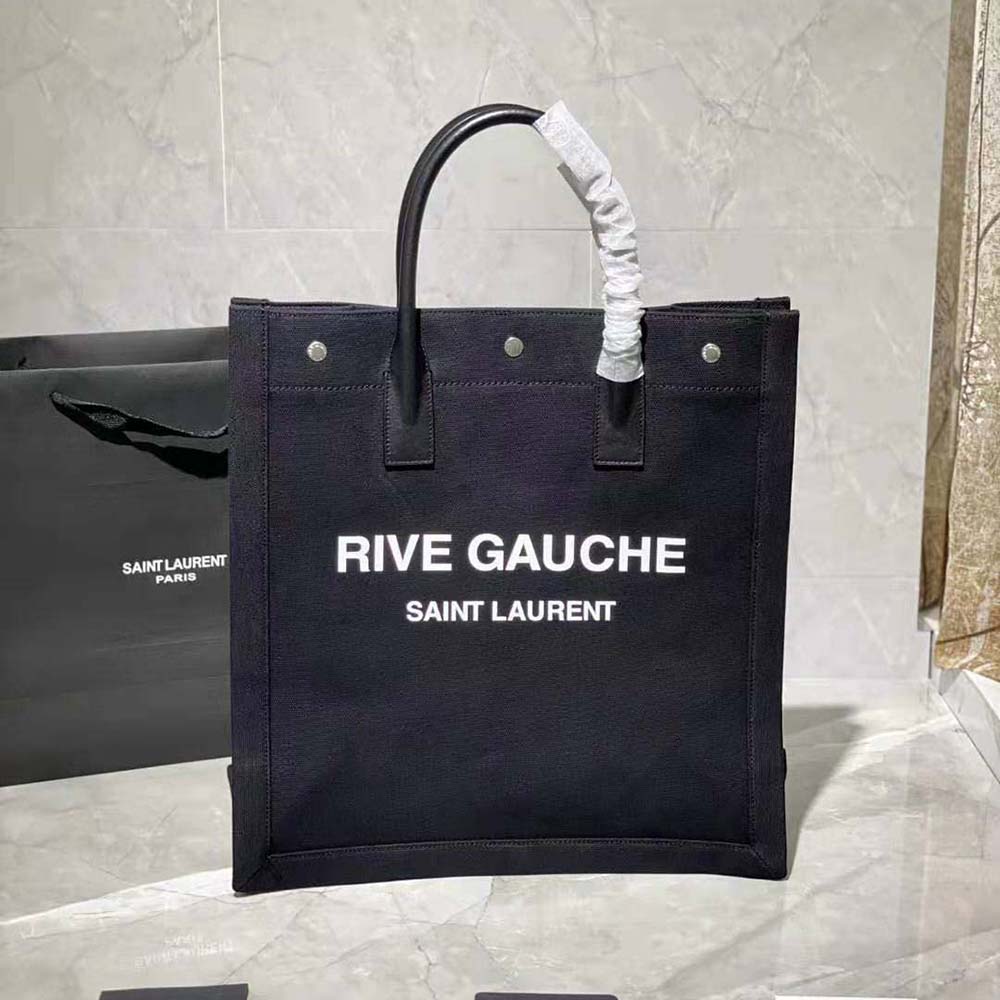 Close-up of black YSL logo detail on Saint Laurent cotton shopping bag