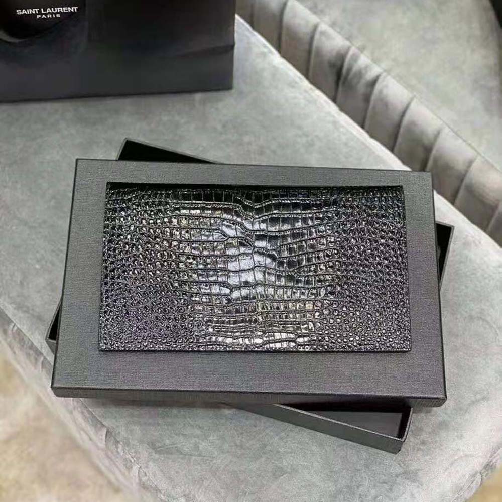 Side angle showing crocodile embossing on Saint Laurent Uptown Pouch