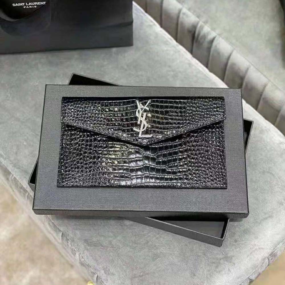 Close-up of silver YSL logo hardware on Uptown Pouch