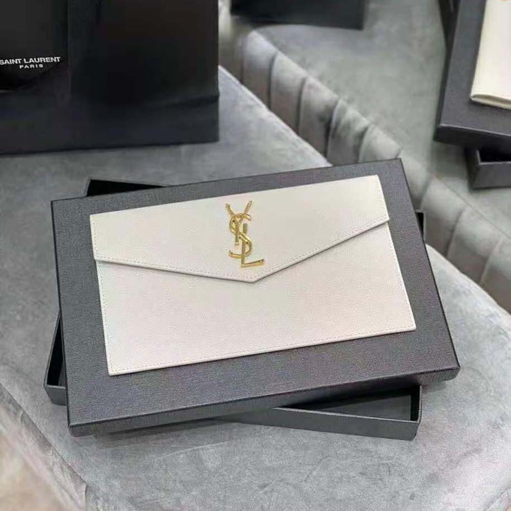 Close-up of gold YSL logo hardware on Uptown Pouch