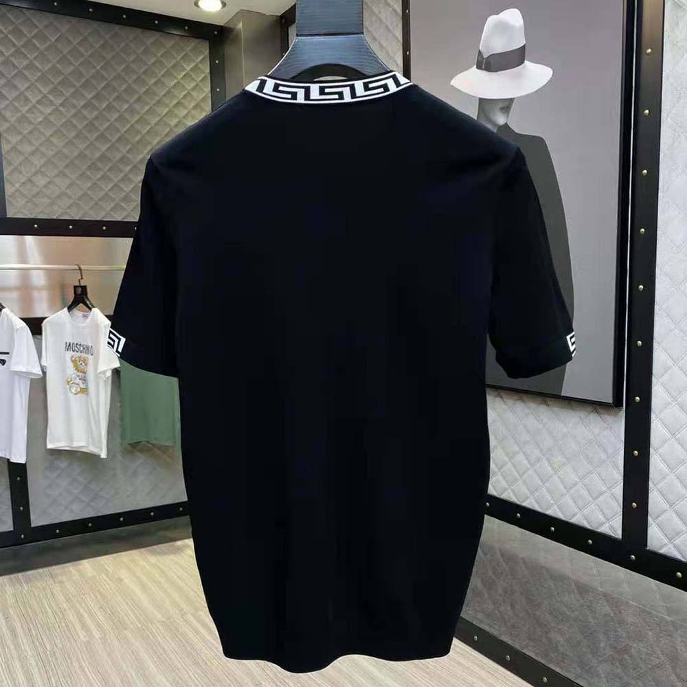 Side angle of Versace Men Logo Embroidered T-shirt-Black on model