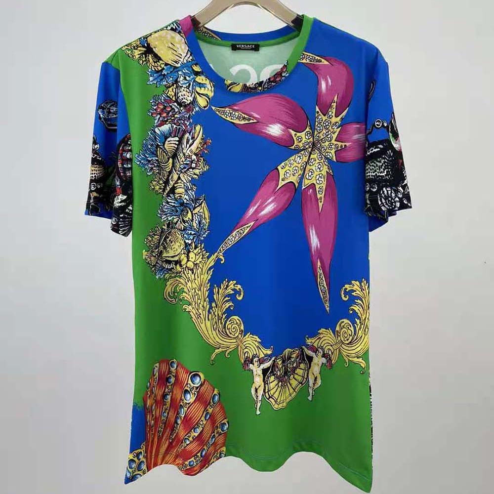 Close-up of green fabric and Versace print on Men Tresor DE LA Mer T-shirt