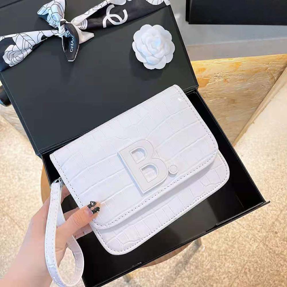 Close-up of silver hardware and crocodile embossing on Balenciaga Women B. Small Bag