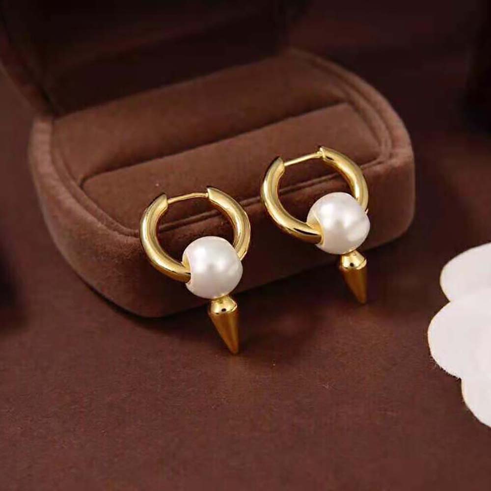 Close-up of gold-toned spike detail on Balenciaga Women Force Spike Earrings