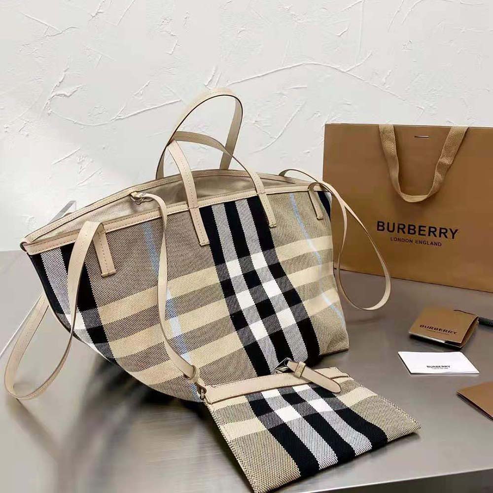 Close-up of Burberry check pattern and gold hardware on beach tote