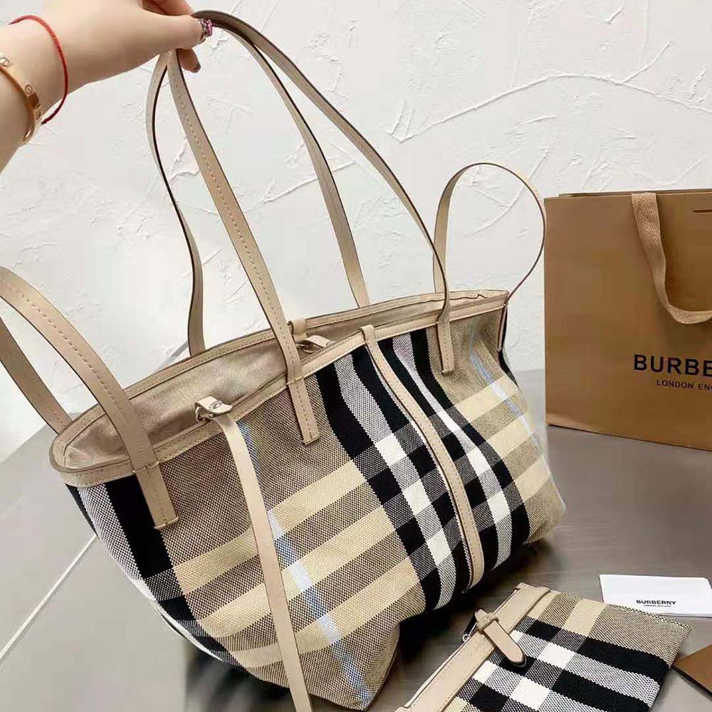 Side angle showing structured silhouette of Burberry Medium Check Canvas Tote