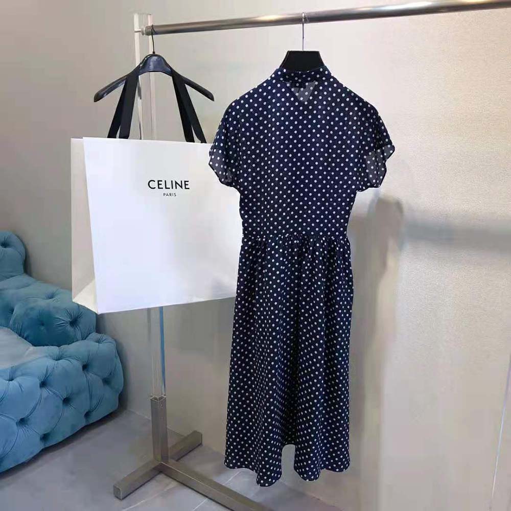 Side angle showing navy silk drape of Celine Women Lavalliere Dress