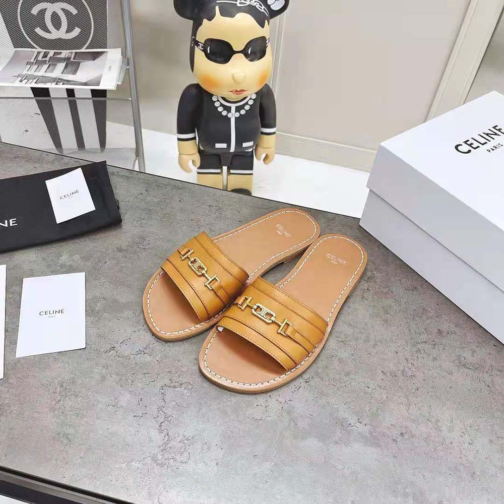 Close-up of gold Triomphe hardware on Celine Lerins slide sandal