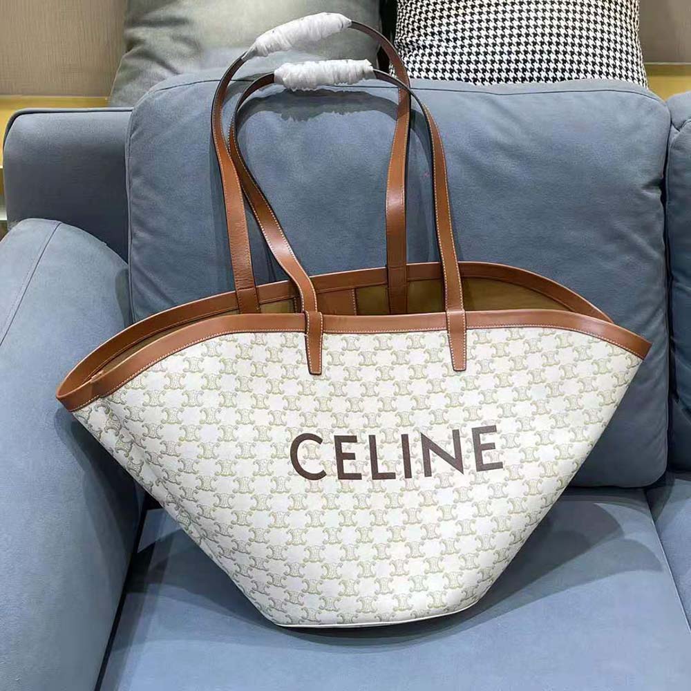 Close-up of gold-tone zipper and signature Celine print on medium couffin bag