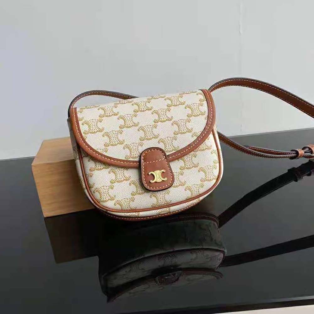 Close-up of gold Triomphe clasp on Celine Women Mini Besace white bag