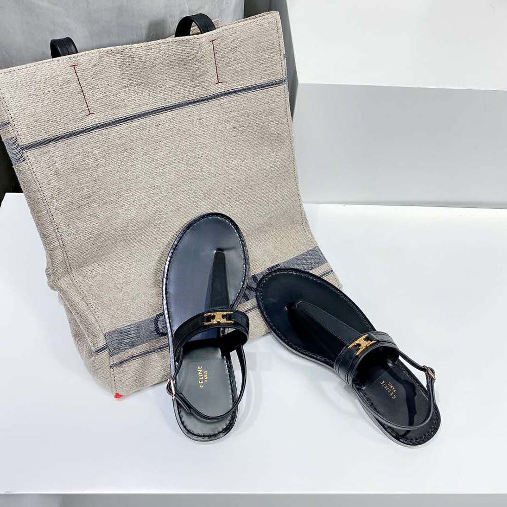 Side profile of black calfskin Celine Women Triomphe Thong sandal