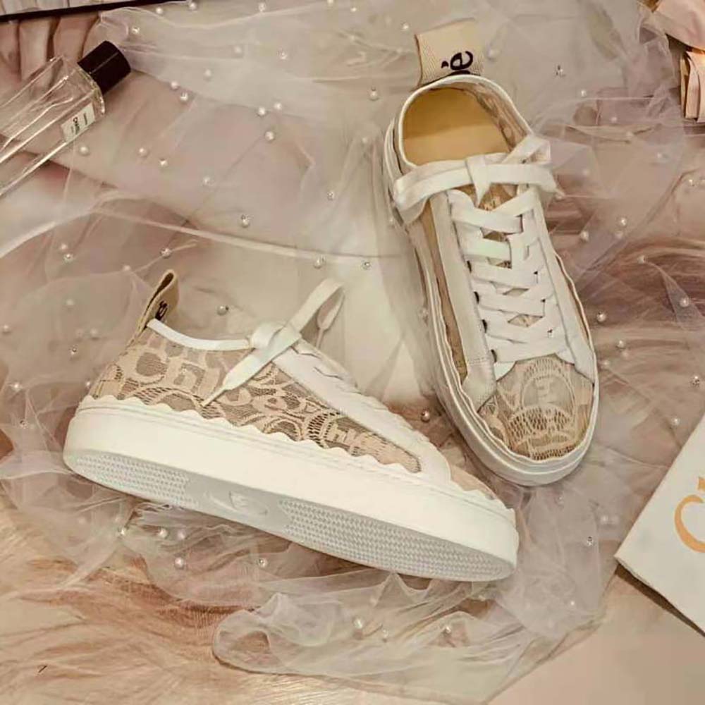 Rear angle of Chloe Women Lauren Sneaker in Lace-Sandy with gold logo