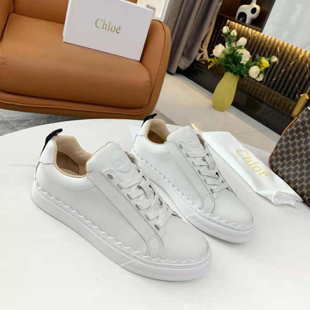 Close-up of gold-tone hardware on Chloe Women Lauren Sneaker
