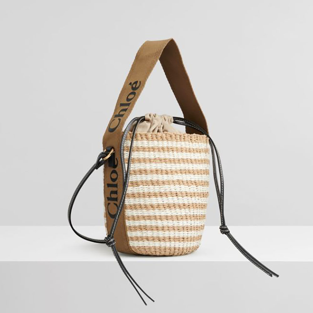 Front view of Chloe Women Small Woody Basket showing beige paper and ribbon