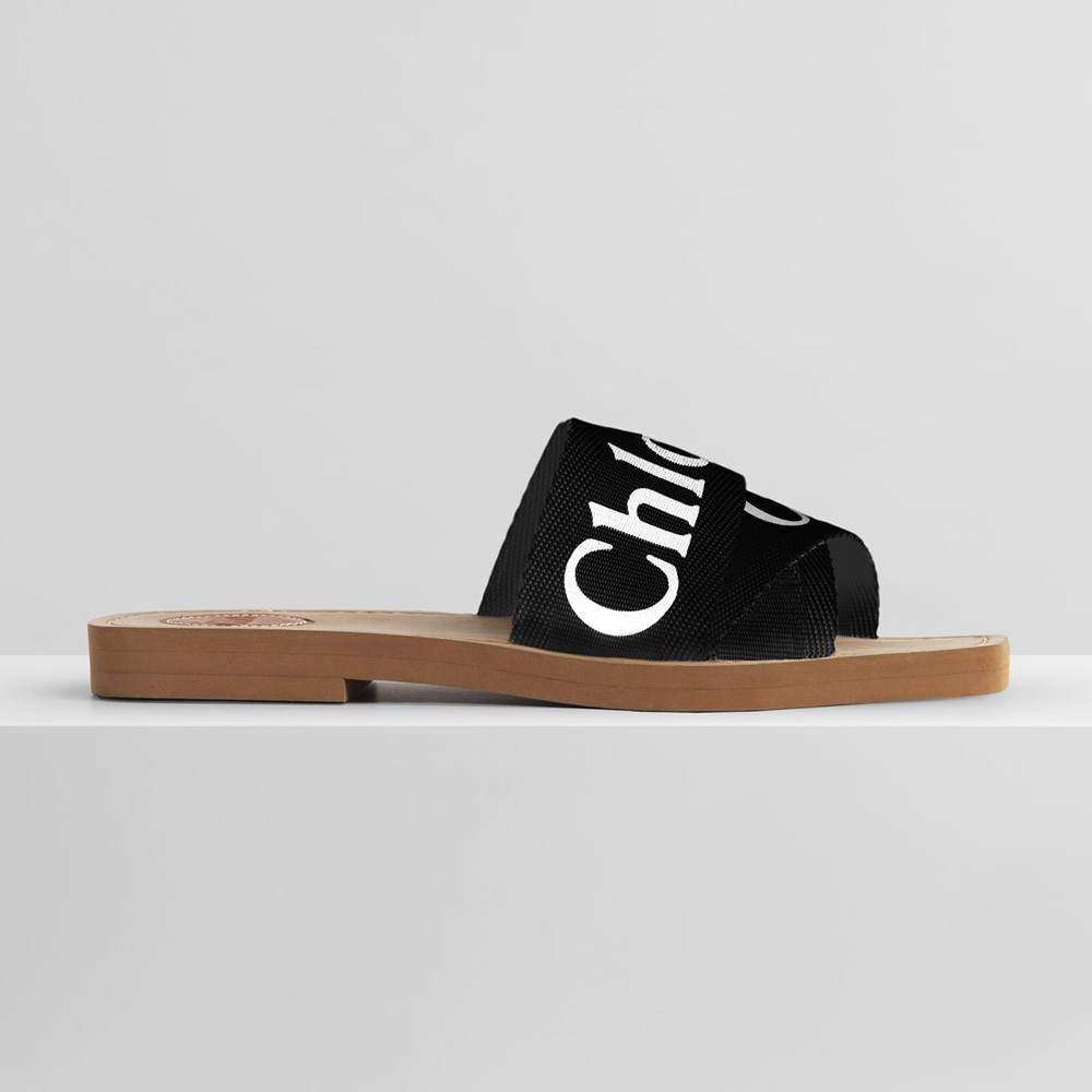 Side view of Chloe Women Woody Flat Mule in Canvas-Black showing silhouette