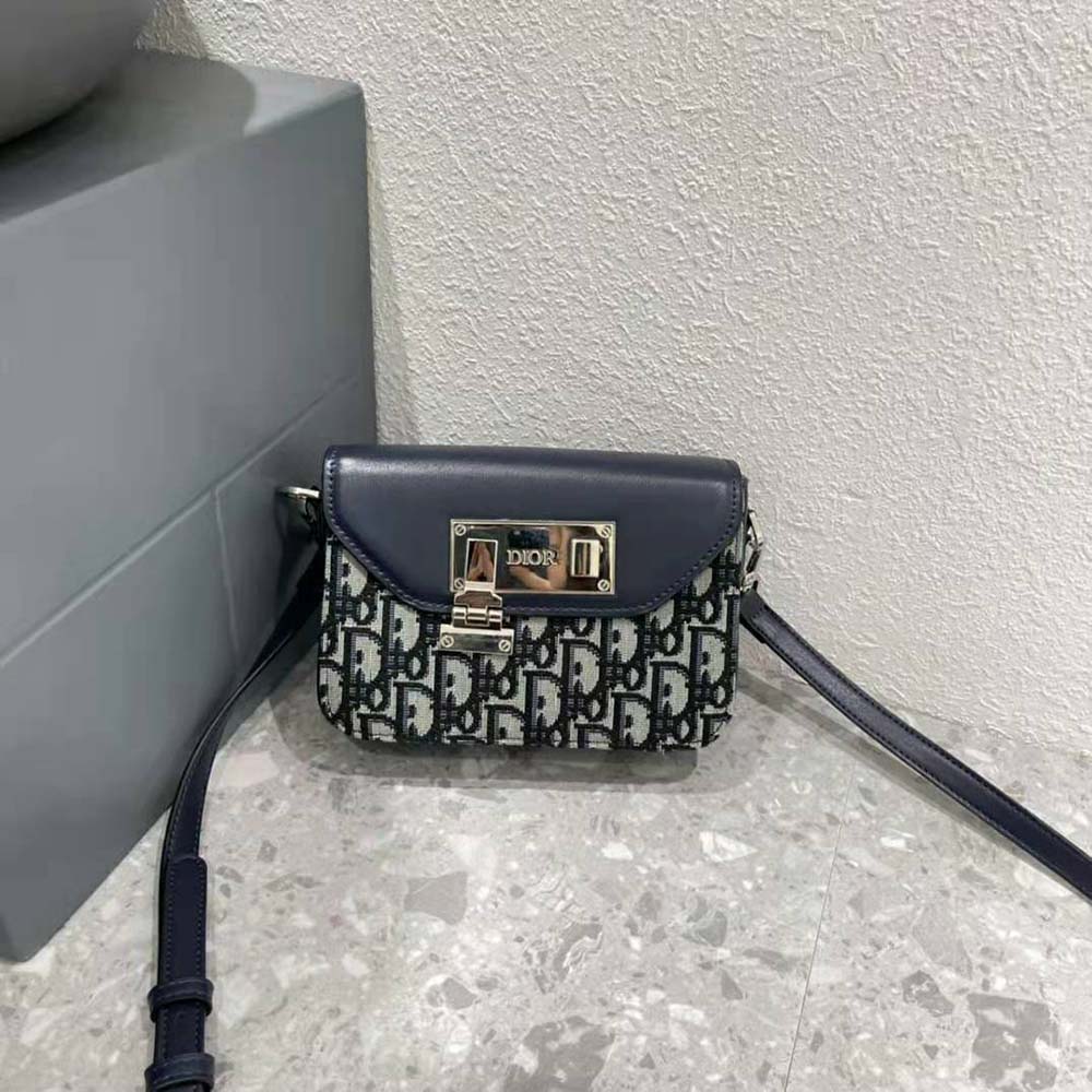 Side angle of Dior Men Nano Pouch with adjustable shoulder strap