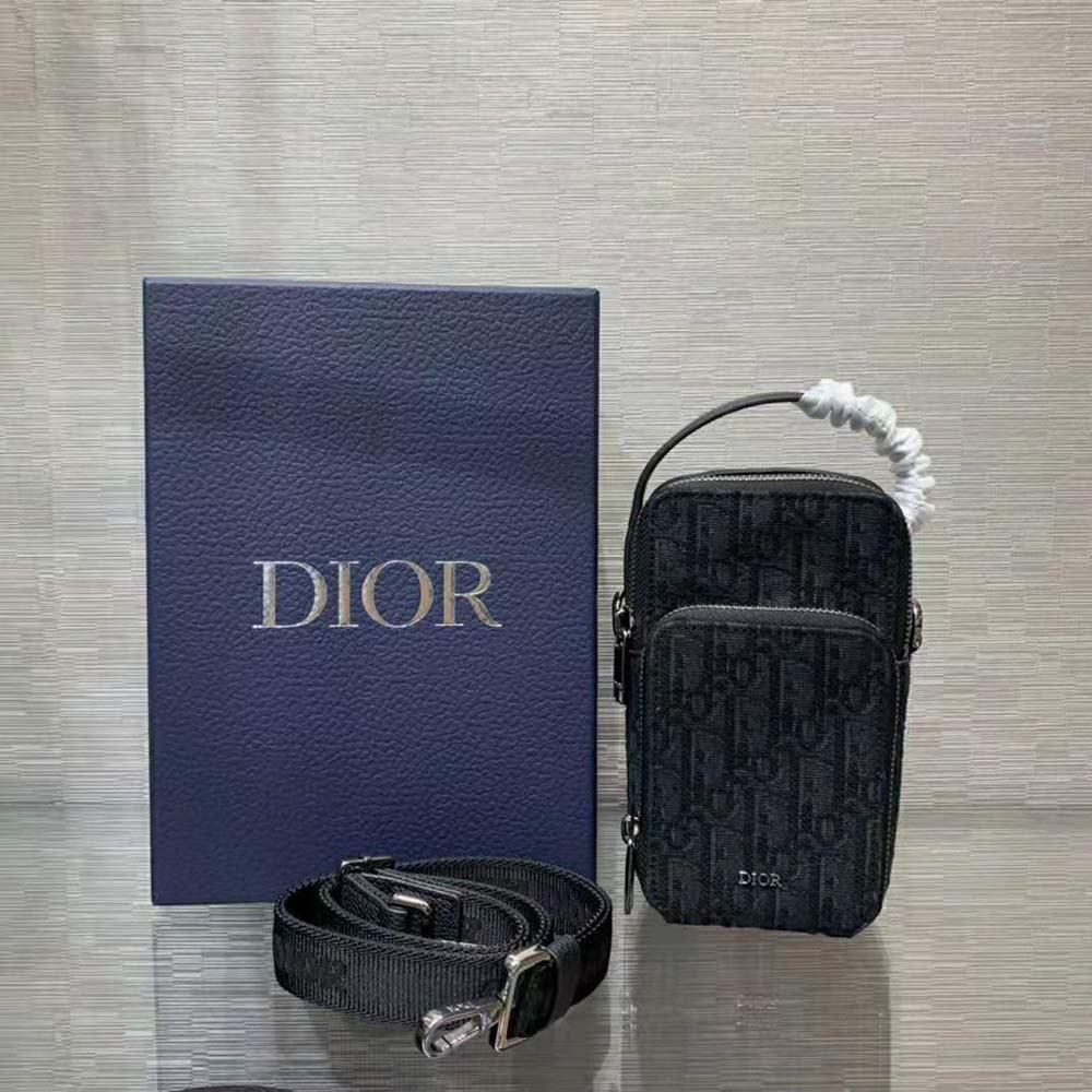 Close-up of Dior Oblique jacquard pattern on Dior Men Pouch
