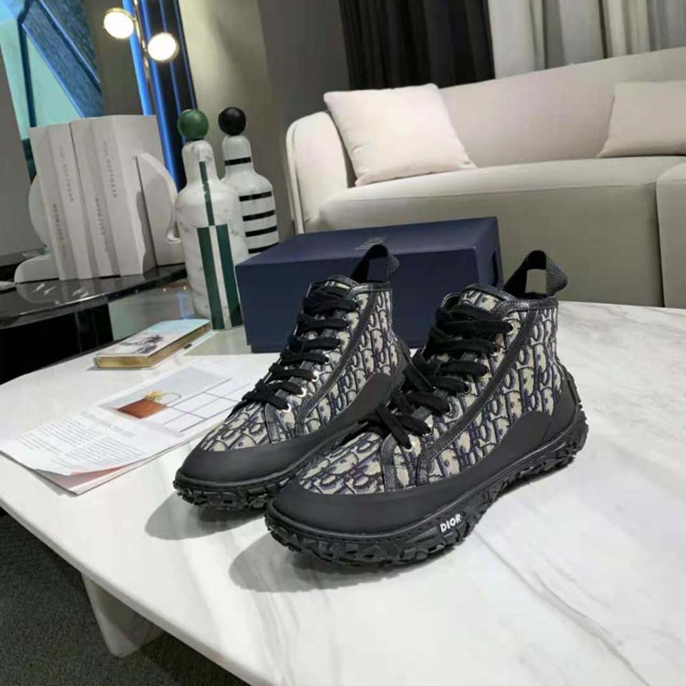 Overhead angle showing laces and black rubber sole of Dior B28 sneaker